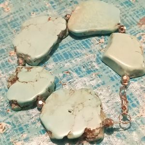 Bracelet, pair of earrings, and necklace